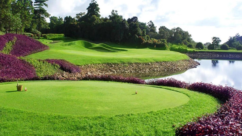 Golfers enjoying a sunny day on the oceanfront fairways of Ria Bintan Golf Club