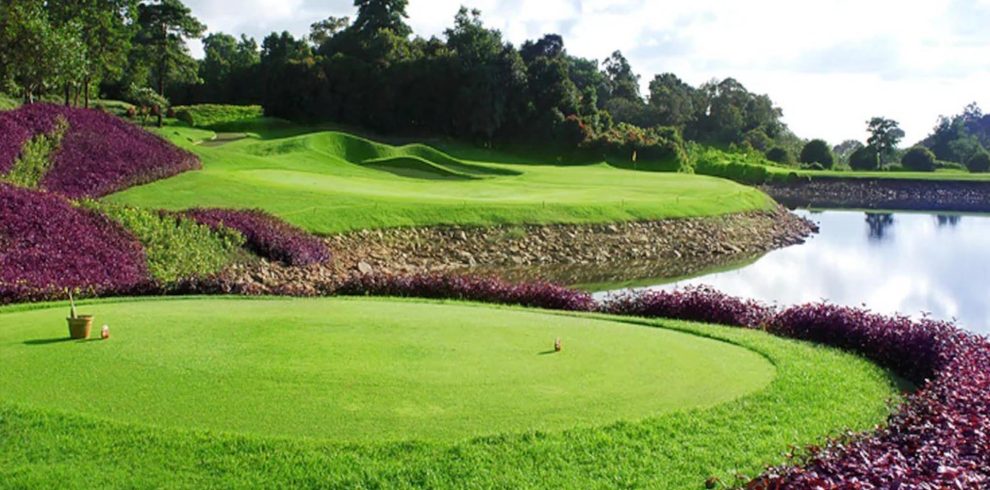 Golfers enjoying a sunny day on the oceanfront fairways of Ria Bintan Golf Club
