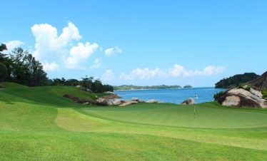 Beautifully manicured fairways at Laguna Golf Bintan, overlooking the turquoise waters of Bintan Island.