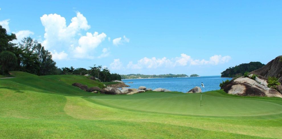 Beautifully manicured fairways at Laguna Golf Bintan, overlooking the turquoise waters of Bintan Island.