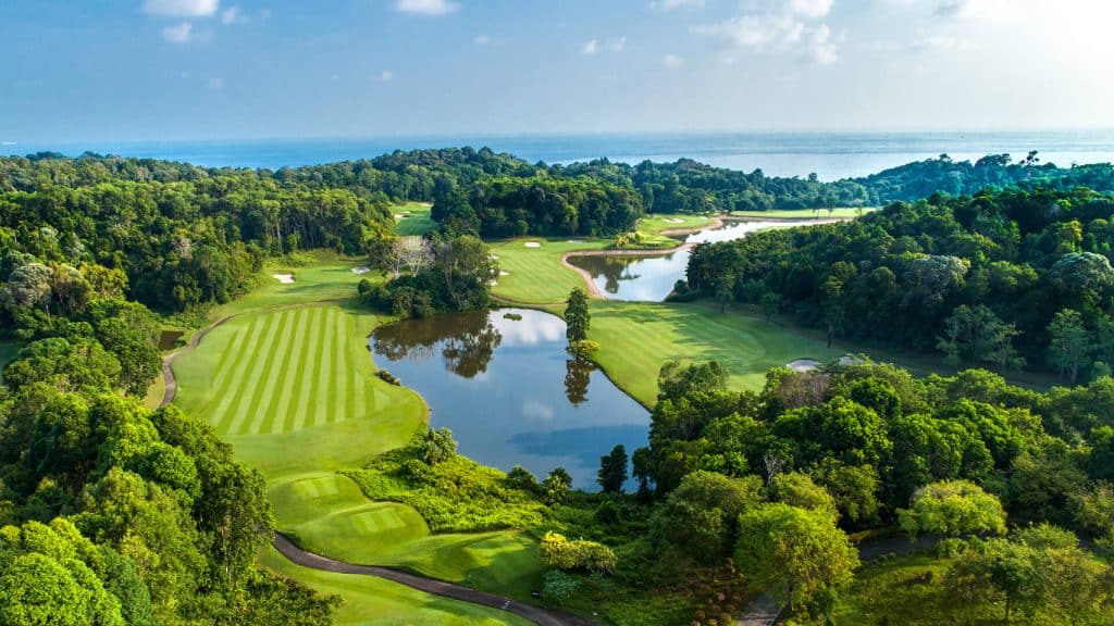 A panoramic view of Ria Bintan Golf Club course overlooking the ocean, a top destination included in Bintan golf packages from South Korea