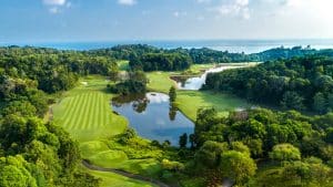 A panoramic view of Ria Bintan Golf Club course overlooking the ocean, a top destination included in Bintan golf packages from South Korea