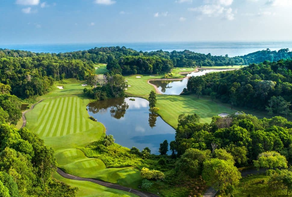 A panoramic view of Ria Bintan Golf Club course overlooking the ocean, a top destination included in Bintan golf packages from South Korea